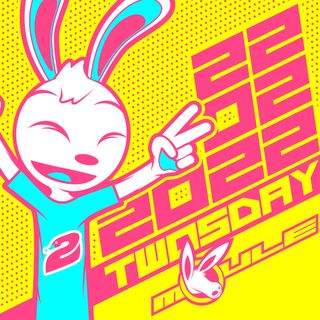 The cover artwork of Twosday, showing Robert the anthropomorphic cartoon rabbit flashing two peace signs in front of the date February 22, 2022. The cover art is a CMYK colour scheme.